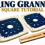 Two navy blue and cream crochet ring granny squares with open circular centers.